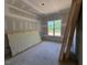 Room with window with view to the outdoors and materials for completion at 348 Inspiration Way, Fuquay Varina, NC 27526