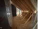 Partially finished attic space, awaiting personalization and offering potential for additional storage at 348 Inspiration Way, Fuquay Varina, NC 27526