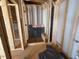 Partially framed bathroom with a built-in shower bench, ready for finishing at 348 Inspiration Way, Fuquay Varina, NC 27526