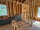 Unfinished bathroom with visible framing, shower stall, and a window for natural light at 348 Inspiration Way, Fuquay Varina, NC 27526