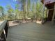 Newly constructed wood deck with black metal railings, offering a relaxing outdoor space at 348 Inspiration Way, Fuquay Varina, NC 27526