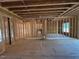 An open concept area framed with electrical and plumbing run showing the in-construction progress at 348 Inspiration Way, Fuquay Varina, NC 27526