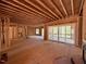 Open concept living area with exposed framing, sliding glass doors, and natural light at 348 Inspiration Way, Fuquay Varina, NC 27526