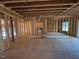 An open concept area framed with electrical and plumbing run showing the in-construction progress at 348 Inspiration Way, Fuquay Varina, NC 27526