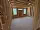 Partially framed room with multiple windows, ready for customization and finishing at 348 Inspiration Way, Fuquay Varina, NC 27526