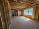 Partially framed room filled with sunlight from multiple windows, ready for finishing at 348 Inspiration Way, Fuquay Varina, NC 27526