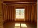 An in-construction room with a large window allowing natural light to flood the area at 348 Inspiration Way, Fuquay Varina, NC 27526