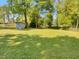 Large, green backyard with mature trees and storage shed at 3504 Crofton Ct, Raleigh, NC 27604