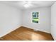 This bedroom is well-lit with hardwood floors and a ceiling fan at 3504 Crofton Ct, Raleigh, NC 27604