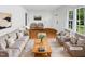Bright living room features stylish furniture, a cozy rug, and hardwood floors at 3504 Crofton Ct, Raleigh, NC 27604