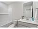 Bathroom featuring a tub and shower combo, and vanity with sink and mirror at 3715 Rosebush Dr, Zebulon, NC 27597