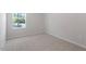 Bedroom with carpeted floors and a window at 3715 Rosebush Dr, Zebulon, NC 27597