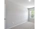 Bedroom with light colored carpet and a window at 3715 Rosebush Dr, Zebulon, NC 27597