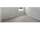 Cozy bedroom with soft, neutral carpet and a bright window with natural light at 3715 Rosebush Dr, Zebulon, NC 27597