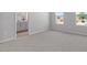 Spacious bedroom featuring carpet, an ensuite bathroom, and bright windows at 3715 Rosebush Dr, Zebulon, NC 27597