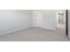 Bedroom with neutral carpet, white walls, and a door leading to another room at 3715 Rosebush Dr, Zebulon, NC 27597
