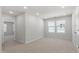 Spacious bedroom featuring plush carpeting, large windows, and ample natural light at 3715 Rosebush Dr, Zebulon, NC 27597