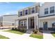 View of a well-maintained home with a cozy front porch, showcasing its inviting curb appeal and modern design at 3715 Rosebush Dr, Zebulon, NC 27597