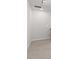 Neutral carpeted hallway leading to the staircase at 3715 Rosebush Dr, Zebulon, NC 27597