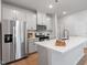Bright kitchen featuring stainless steel appliances, a center island with sink, and plenty of counter space at 3715 Rosebush Dr, Zebulon, NC 27597