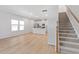 Bright and airy living space with sleek hardwood floors and modern stairs, perfect for Gathering gatherings at 3715 Rosebush Dr, Zebulon, NC 27597