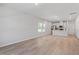 Bright living room featuring modern floors, recessed lighting, and an open layout to the kitchen at 3715 Rosebush Dr, Zebulon, NC 27597