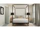 Inviting bedroom featuring a canopy bed, side tables with lamps, and neutral decor at 4008 Shadbush St, Raleigh, NC 27616