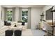 Cozy living room features a comfortable sofa, desk and large windows with views at 4008 Shadbush St, Raleigh, NC 27616
