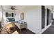 Cozy back porch with comfortable seating, a swing, and a ceiling fan for relaxing outdoors at 402 Vatersay Dr, Apex, NC 27502