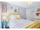 Bedroom featuring bright yellow accents and whimsical decor elements at 402 Vatersay Dr, Apex, NC 27502