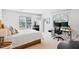 Comfortable bedroom area, featuring two windows and a work desk at 402 Vatersay Dr, Apex, NC 27502