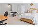 Bedroom featuring a large bed, round table and a work area at 402 Vatersay Dr, Apex, NC 27502