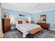 Bedroom with soft blue walls, carpet, light fixtures and a queen-sized bed at 402 Vatersay Dr, Apex, NC 27502