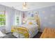 Stylish bedroom featuring bright yellow accents and whimsical decor elements at 402 Vatersay Dr, Apex, NC 27502