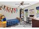Cozy bedroom featuring natural light and a small desk area at 402 Vatersay Dr, Apex, NC 27502