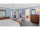 Spacious bedroom showcasing an ensuite bathroom, walk-in closet, and natural light at 402 Vatersay Dr, Apex, NC 27502