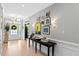 Inviting foyer with elegant console table, decor, and a well-lit entrance, creating a warm welcome at 402 Vatersay Dr, Apex, NC 27502