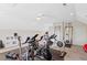 Spacious home gym features exercise equipment, ceiling fan, and ample lighting at 402 Vatersay Dr, Apex, NC 27502