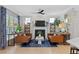 Cozy living room featuring fireplace, comfortable seating, and natural light, creating a relaxing atmosphere at 402 Vatersay Dr, Apex, NC 27502