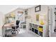 Bright home office features a window, desk, shelving, and comfortable workspace at 402 Vatersay Dr, Apex, NC 27502