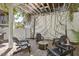 Comfortable outdoor patio with seating area, featuring overhead structure with climbing vines at 402 Vatersay Dr, Apex, NC 27502