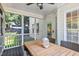 Relaxing screened-in porch with a wood table and view of the backyard at 402 Vatersay Dr, Apex, NC 27502
