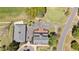 Birds eye view of a clubhouse, parking lot, and putting green at a golf course at 4936 Liverpool Ln, Raleigh, NC 27604