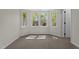 A well-lit bedroom featuring a bay window and neutral carpet at 4936 Liverpool Ln, Raleigh, NC 27604