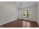 Bedroom with vaulted ceilings, hardwood floors, and plenty of natural light at 4936 Liverpool Ln, Raleigh, NC 27604