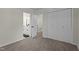 Bedroom featuring neutral colored walls, carpet, and a view into the bathroom at 4936 Liverpool Ln, Raleigh, NC 27604
