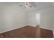 Bedroom featuring a ceiling fan, wood flooring, and a view of the ensuite bath at 4936 Liverpool Ln, Raleigh, NC 27604