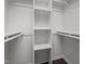 Walk-in closet offering built-in shelving and ample storage space at 4936 Liverpool Ln, Raleigh, NC 27604