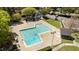 Aerial view of the community pool with fences, chairs, and a bath house at 4936 Liverpool Ln, Raleigh, NC 27604