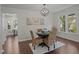 Dining area featuring a round table, stylish chairs, and views of the outdoors at 4936 Liverpool Ln, Raleigh, NC 27604